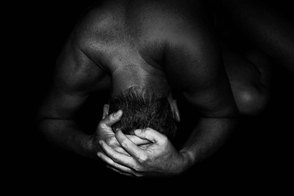 Black & White Photograph of a man in submission