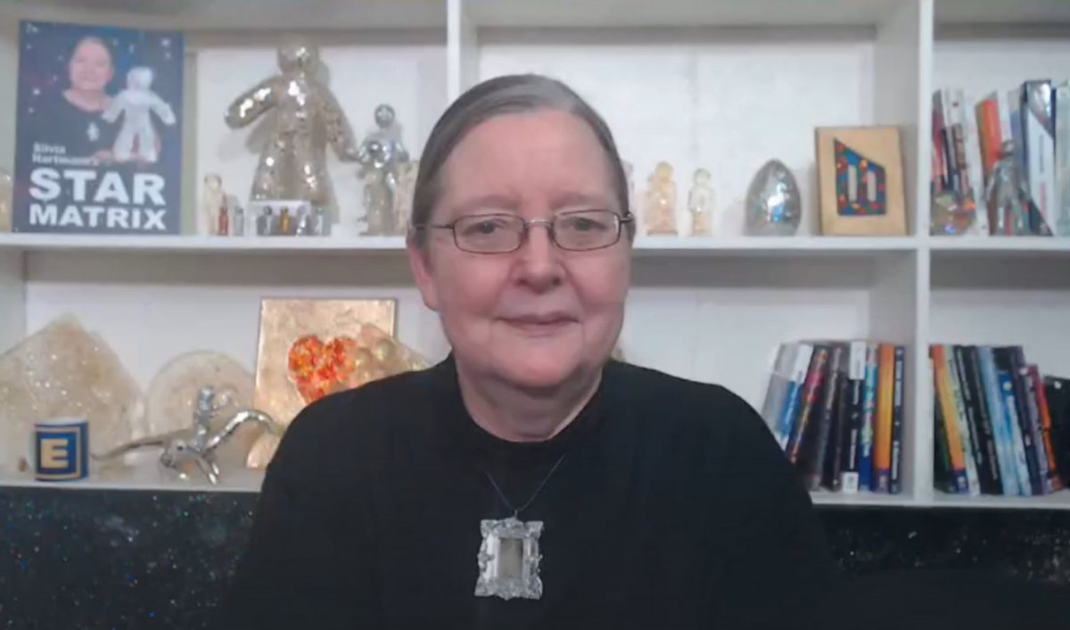 Video screenshot of Silvia Hartmann wearing the Mirror Charm